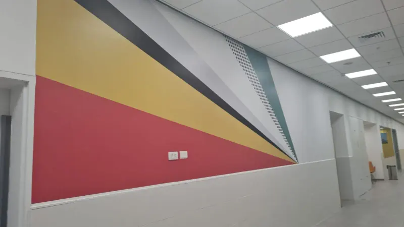 Colorful geometric triangle vinyl wall sticker in hallway — SignWorks